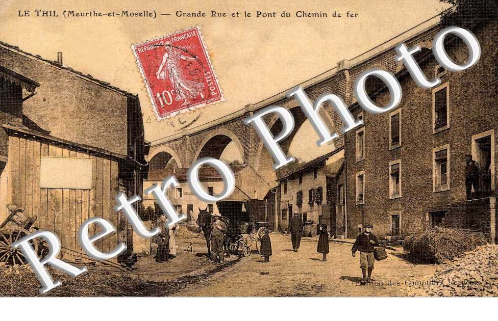 grande rue et le pont du chemin de fer edition des Comptoirs Francais (carte toilee couleur)