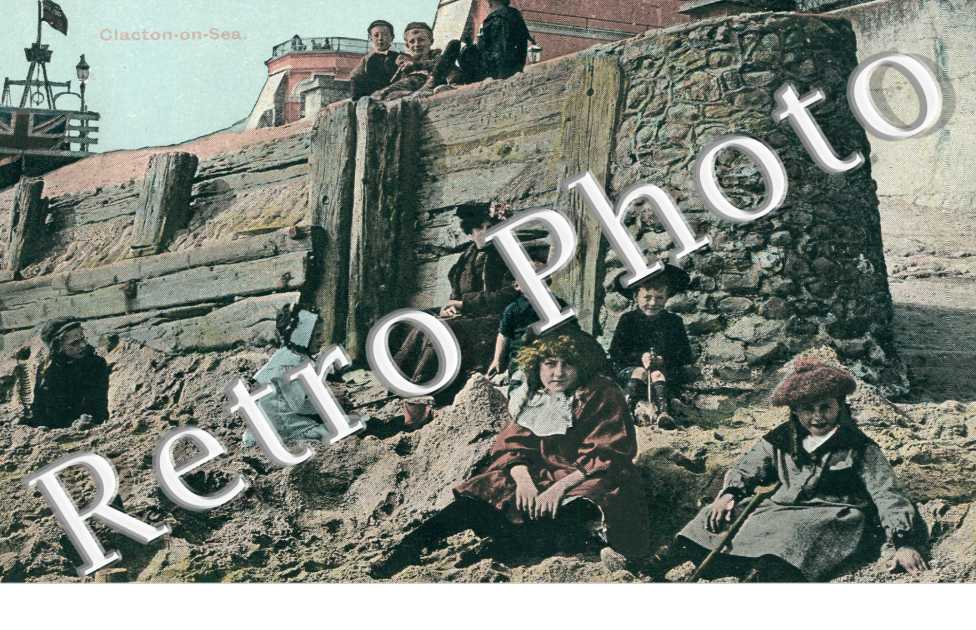 Children sitting on the sand