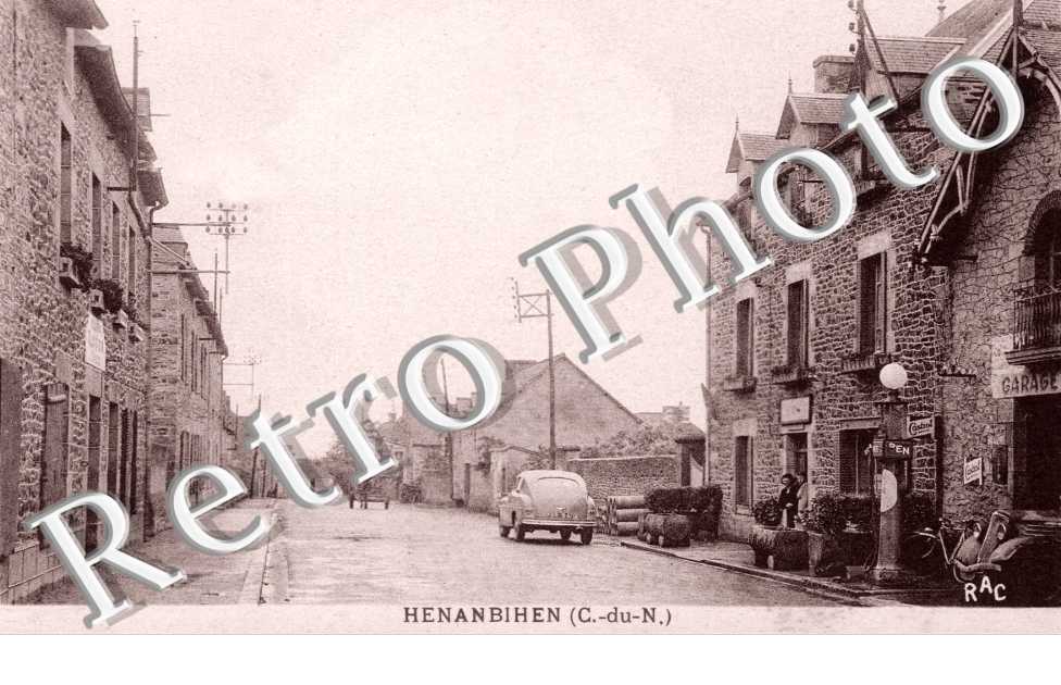 rue principale avec garage automobile et  pompe a essence