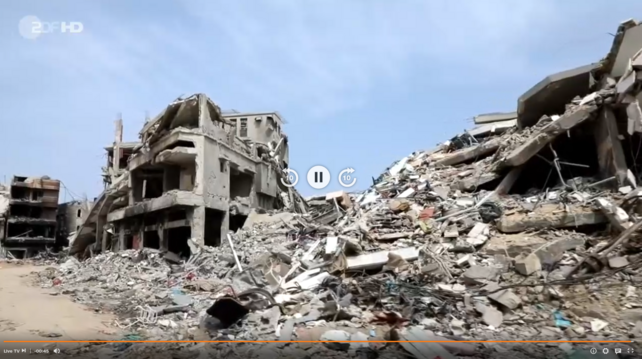 Screenshot eines Bildes von zerbombten Gebäuden im Gazastreifen, die zum Zufluchtsort für Menschen aus Rafah werden sollen, damit diese der Offensive der israelischen Armee ausweichen sollen, um nicht getötet oder verletzt zu werden. 