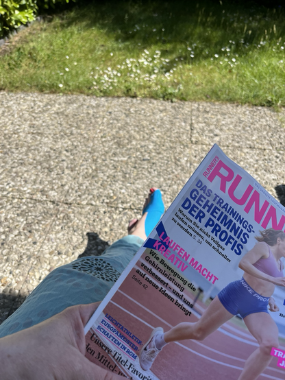 Hurt and taped tooth and leg, new edition of a runner's magazin, sunshine