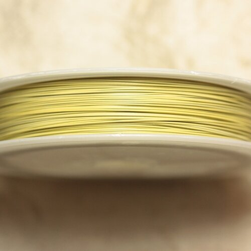 Bobine 70 mètres - fil métal câblé 0.38mm jaune clair pastel - 4558550024565