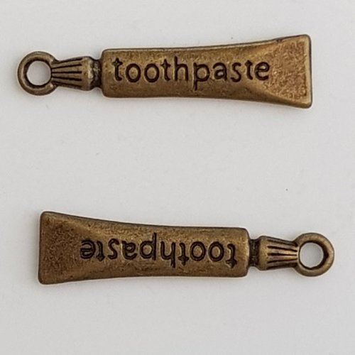 Breloque tube dentifrice bronze
