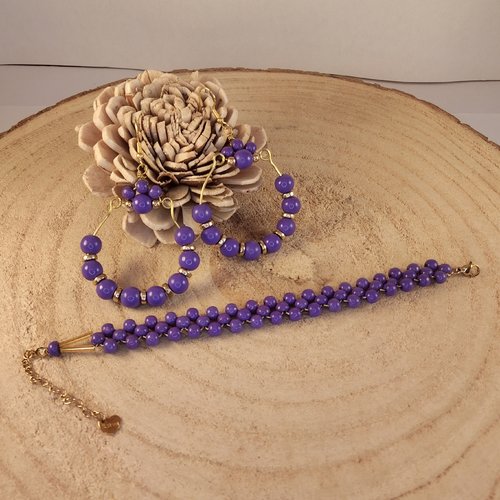 Parure, bracelet et boucles d'oreilles  en acier inoxydable doré et perles en bois violettes.