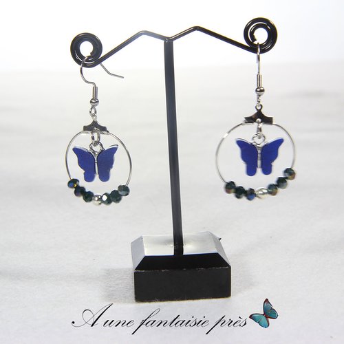 Boucle d'oreille argenté papillon et perle bleu