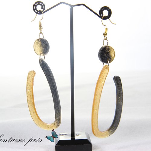 Boucle d'oreille doré demi-ovale doré et noir