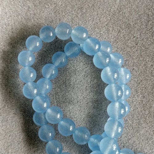 Lot de 10 perles de calcédoine bleu clair rondes en pierre naturelle 4 mm.