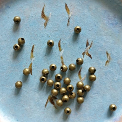 Lot de 20 perles à gros trou en laiton bronze antique de 4 mm de diamètre extérieur.
