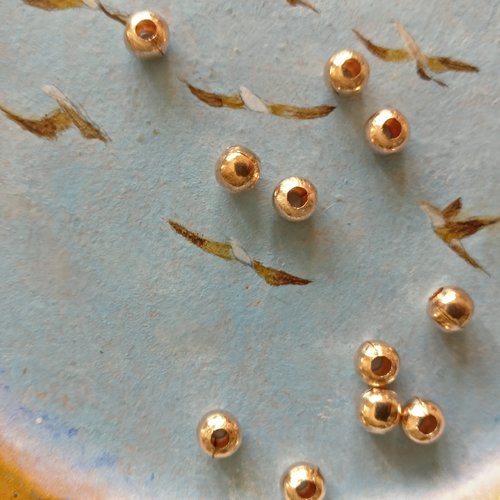 Lot de 20 perles à gros trou métal rose gold de 5 mm de diamètre extérieur.