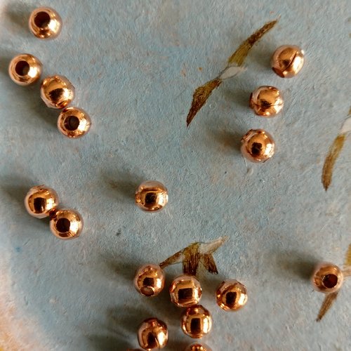 Lot de 20 perles à gros trou métal rose gold de 6 mm de diamètre extérieur.
