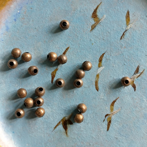 Lot de 20 perles à gros trou cuivre de 3 mm de diamètre extérieur.
