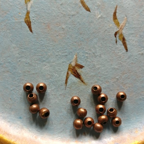 Lot de 20 perles à gros trou cuivre de 4 mm de diamètre extérieur.