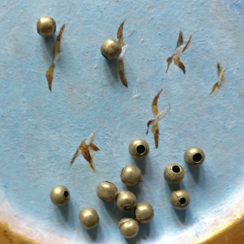 Lot de 20 perles à gros trou bronze de 6 mm de diamètre extérieur.