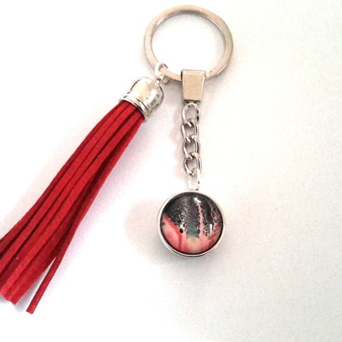 Porte clé / bijou de sac a bouton pression snap 18mm abstrait aux tons rouge / noir à pompon bleu rouge