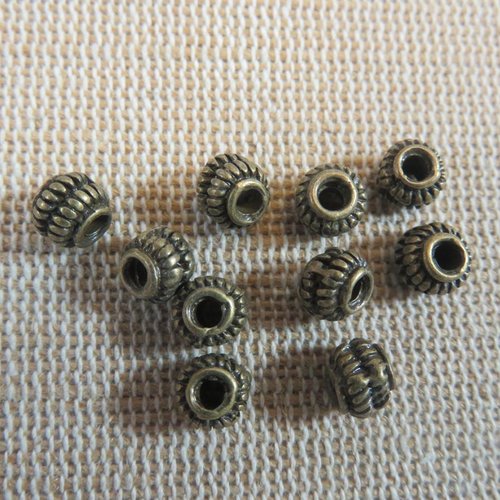 Perles tonneau bronze strié 6x5mm - lot de 10