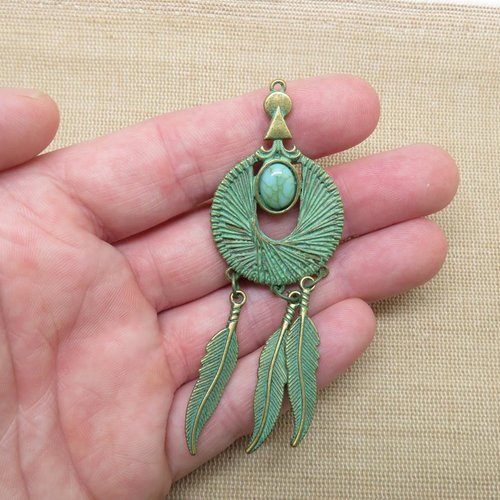 Pendentif attrape rêve et plume métal coloris bronze patiné antique