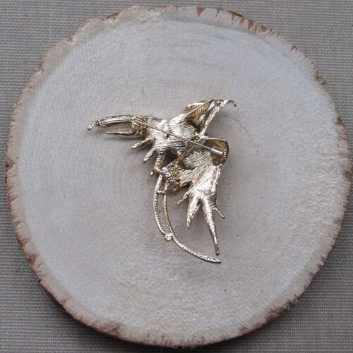 Pendentif oiseau volant acier inoxydable doré 16x18mm