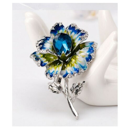 Broche bijou épingle fleur cristal bleu en acier.