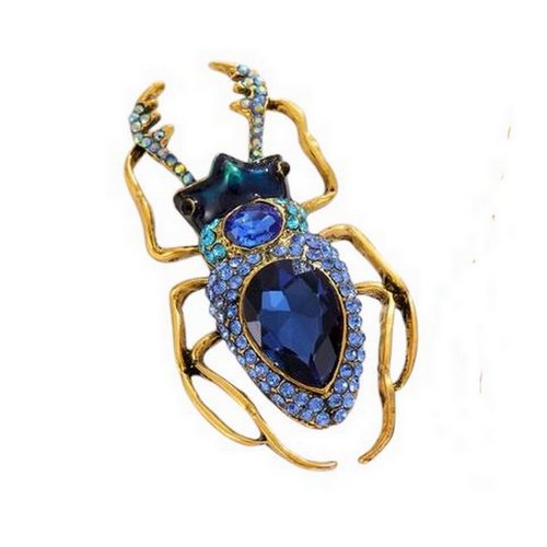 Broche bijou insecte coléoptère style scarabée acier bronze et cristal bleu.