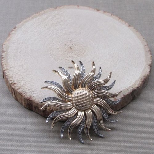 Broche bijou grand soleil doré et argenté en acier inoxydable.