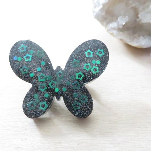 Broche papillon à paillettes holographique noir et petites étoiles