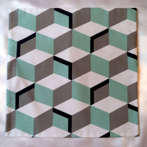 Housse de coussin en coton, 40x40, motifs géométriques gris, blanc et turquoise.