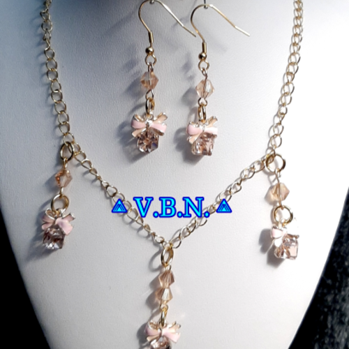 Parure inoxydable doré avec cadeaux ruban rose perles bicone cristal