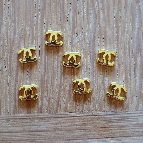 Bijoux d'ongles logos marque de luxe en métal doré (479.8497)