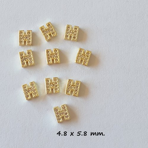 Bijoux d'ongles charms logos marque de luxe en métal doré et strass (482.6000)