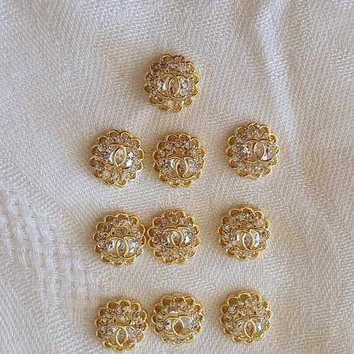 Bijoux d'ongles charms logos en métal doré et strass (484.9313)
