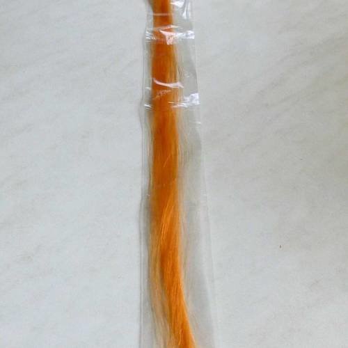 2 extensions de cheveux couleur orange  61cm