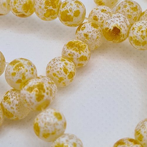 Lot de 10 perles en verre jaunes tachetées
