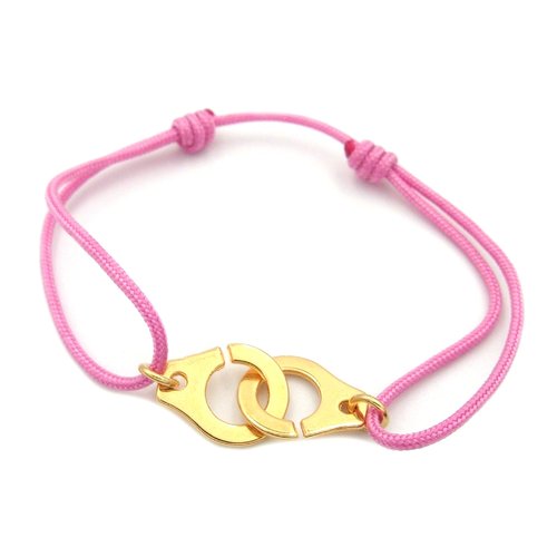 Bracelet menotte doré et cordon rose