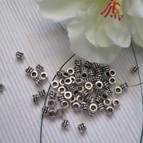 Lot de 8 perles 6x4.5mm striées argent tibétain trou de 3mm
