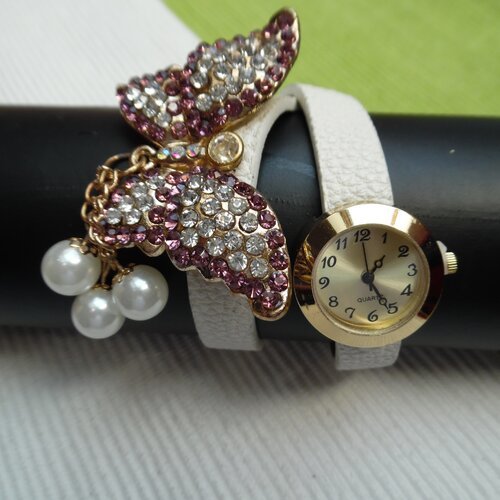 Montre doré avec papillon strass bracelet simili cuir blanc 