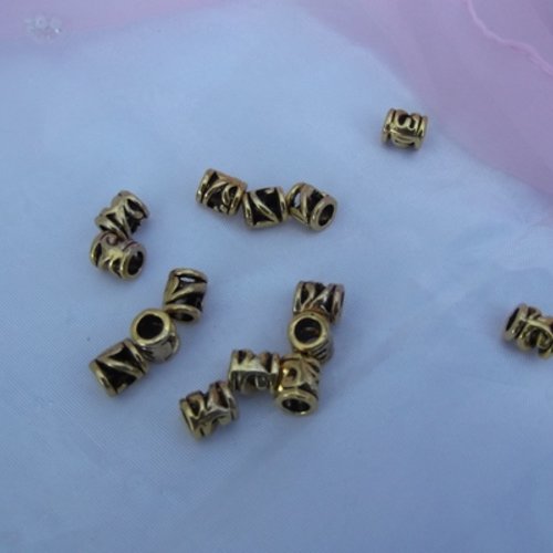 4 perles tubes ajourées 8.6x7.6mm cuivre doré trou de 4.7mm