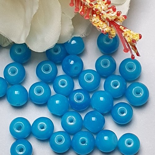 10 perles jade ton bleu foncé 8x7.5mm trou de 1.5mm. n°65