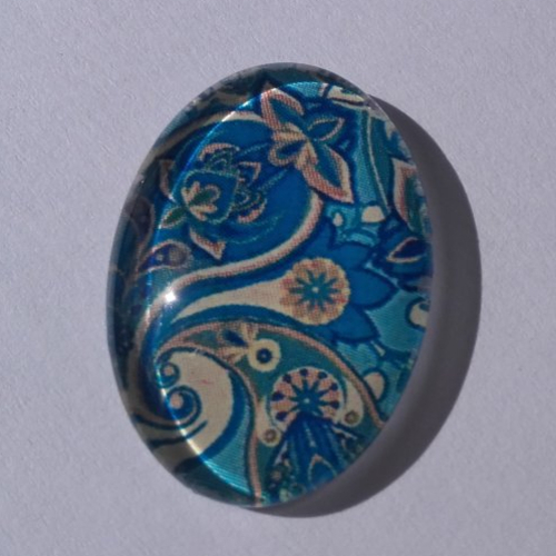 Cabochon de verre, arabesques, bleu, beige, ovale, 25 x 18 mm
