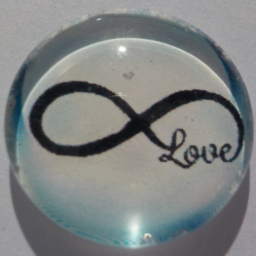Cabochon de verre signe de l'infini bleu et noir