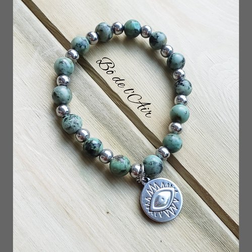 Bracelet perles gemmes turquoise africaine, acier et médaille œil porte-bonheur