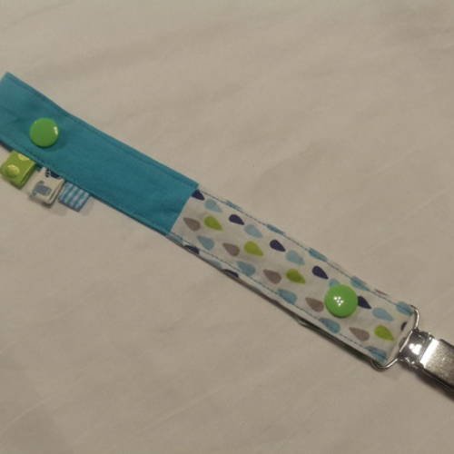 Attache-tétine en tissus avec pression et attache type bretelle colori turquoise et vert anis