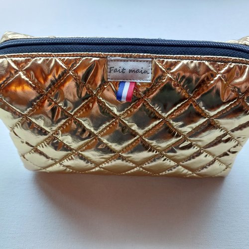 Trousse maquillage matelassée  doublée  en coton enduit sans poche intérieure