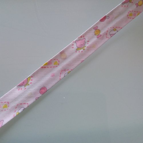 Biais motif enfant - 100% coton - 2 cm de large - fond rose motifs rose et jaune- vendu au mètre