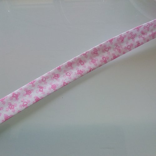 Biais motif enfant - 35% coton 65 % polyester - 2 cm de large - fond blanc motifs rose - vendu au mètre