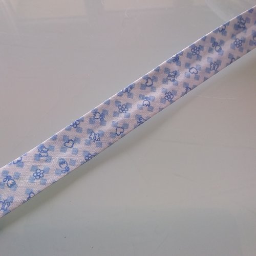 Biais motif enfant - 35% coton 65 % polyester - 2 cm de large - fond blanc motifs bleu - vendu au mètre