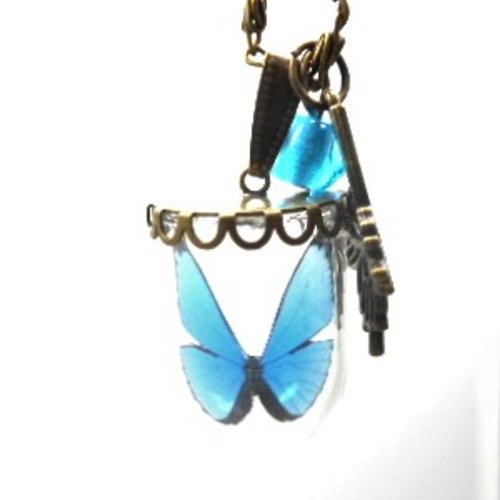 Collier sautoir globe en verre papillon bleu et perle filée bleue par breloques et cie