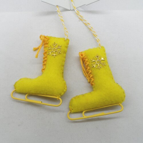 N°62 paire de patins à glace n°2 lame lacet jaune flocon doré ficelle blanche et jaune