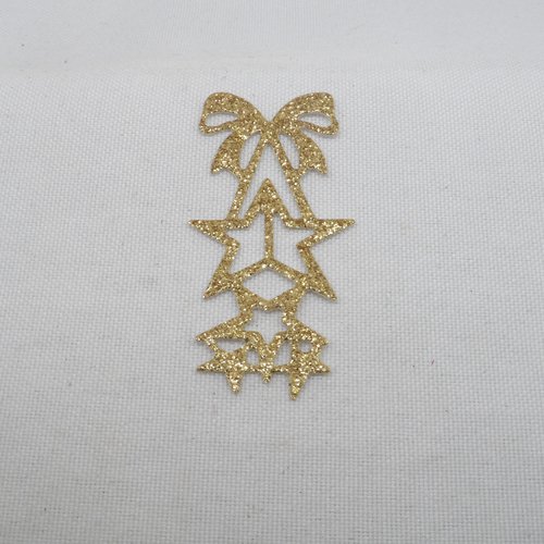 N°881  décoration de noël  nœud et étoiles en papier  doré à paillettes  découpage  fin
