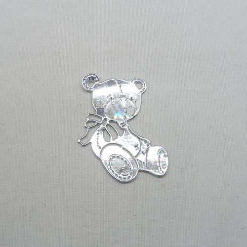 N°665 adorable petit ourson   en papier argenté hologramme  découpage fin et gaufrage