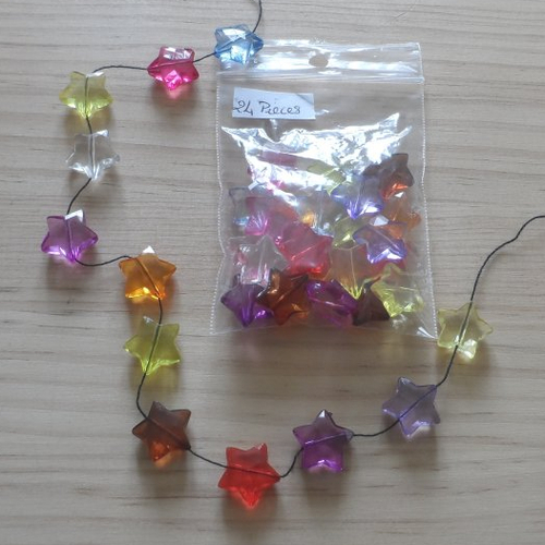 N°438 lot de 24 petites perles étoiles transparentes  diverses couleurs